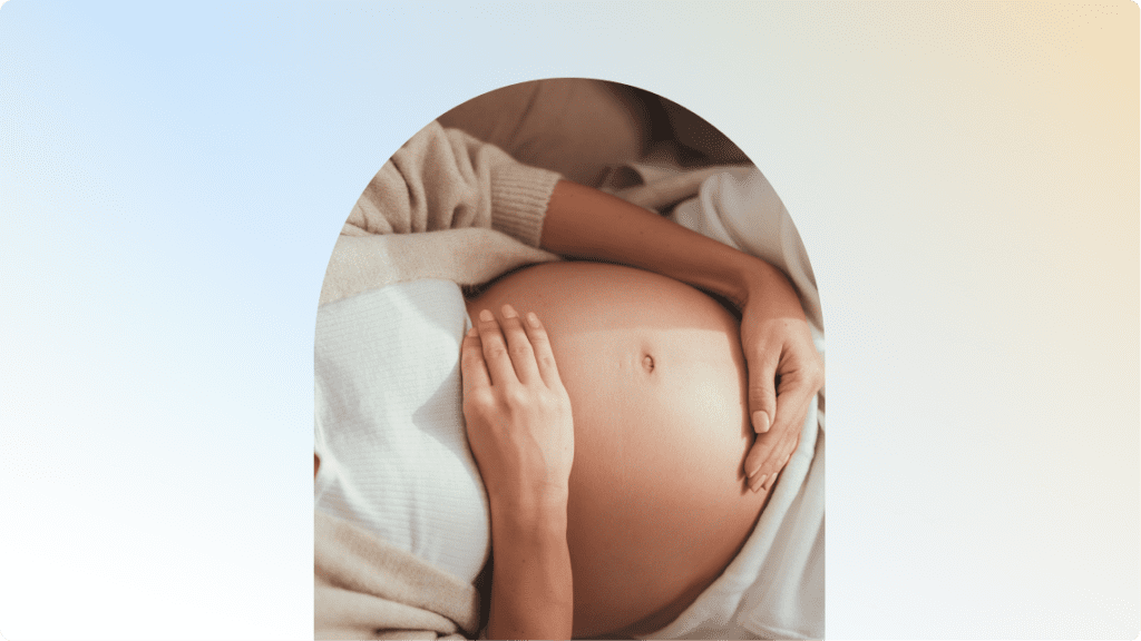 a close-up of a person's pregnant belly