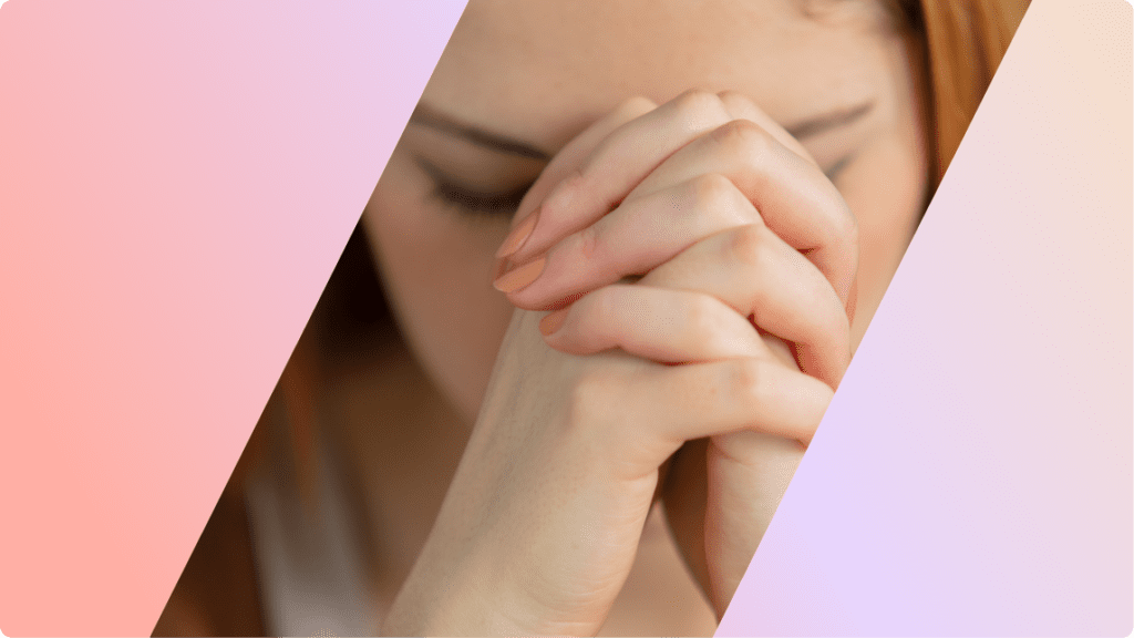 a person with their hands together, praying